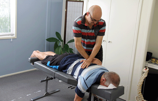 Chiropractor Dr David Malone performs chiropractic technique